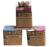 Three bars of soap with labels.
